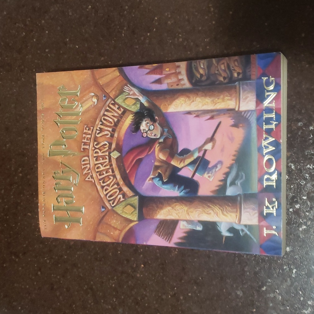 Harry Potter and the Sorcerer's Stone paper back.